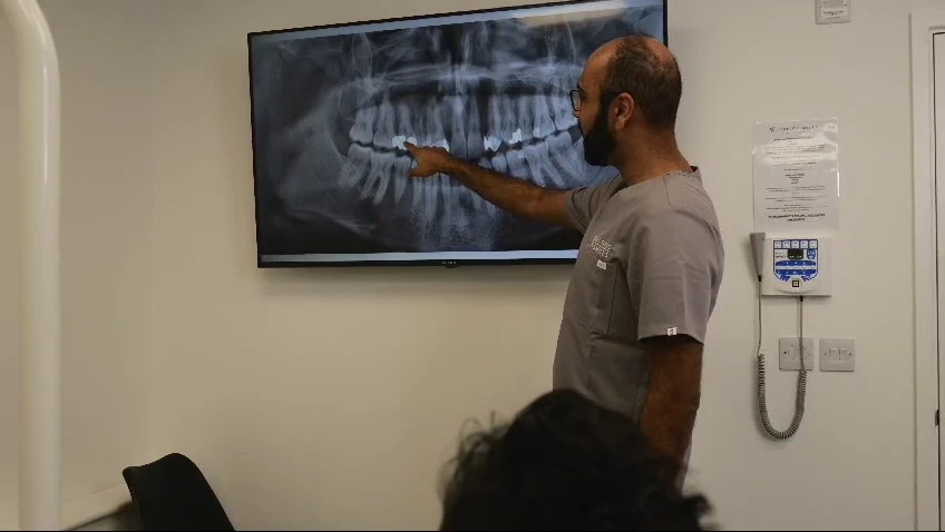 An Iconic Smiles clinician reviewing imaging during treatment planning